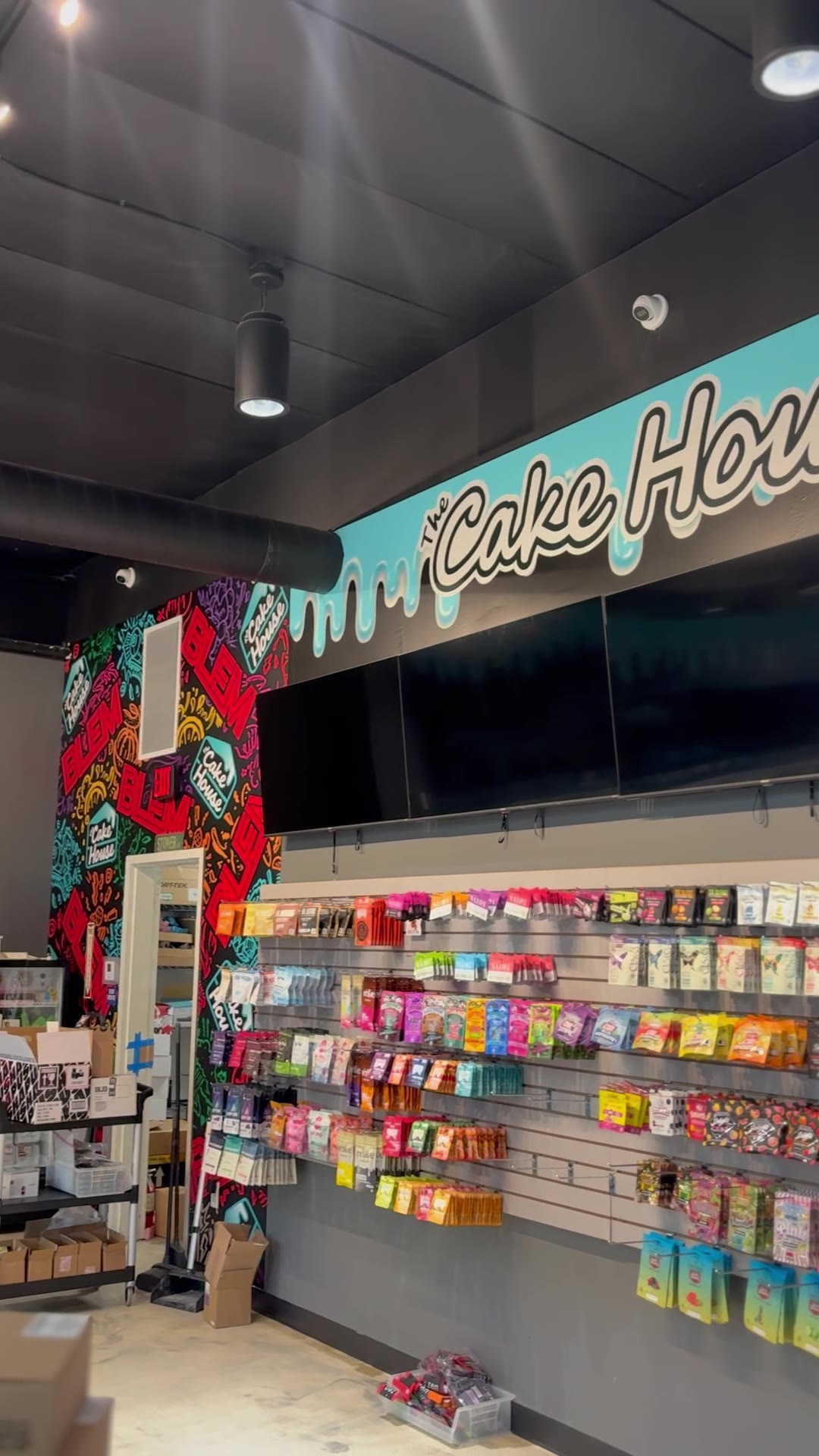 Mural logo wall and product shelving under the drip band
